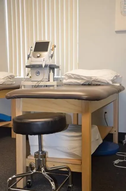 Treatment table with an electrotherapy unit