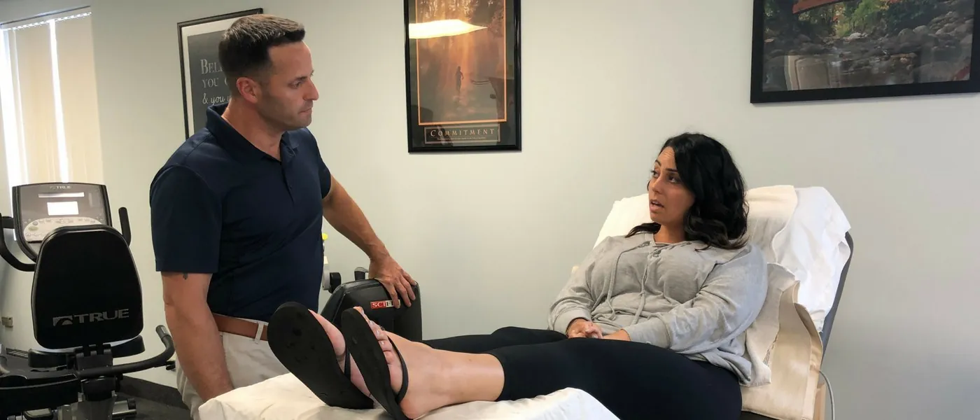 Therapist talking with a patient during treatment